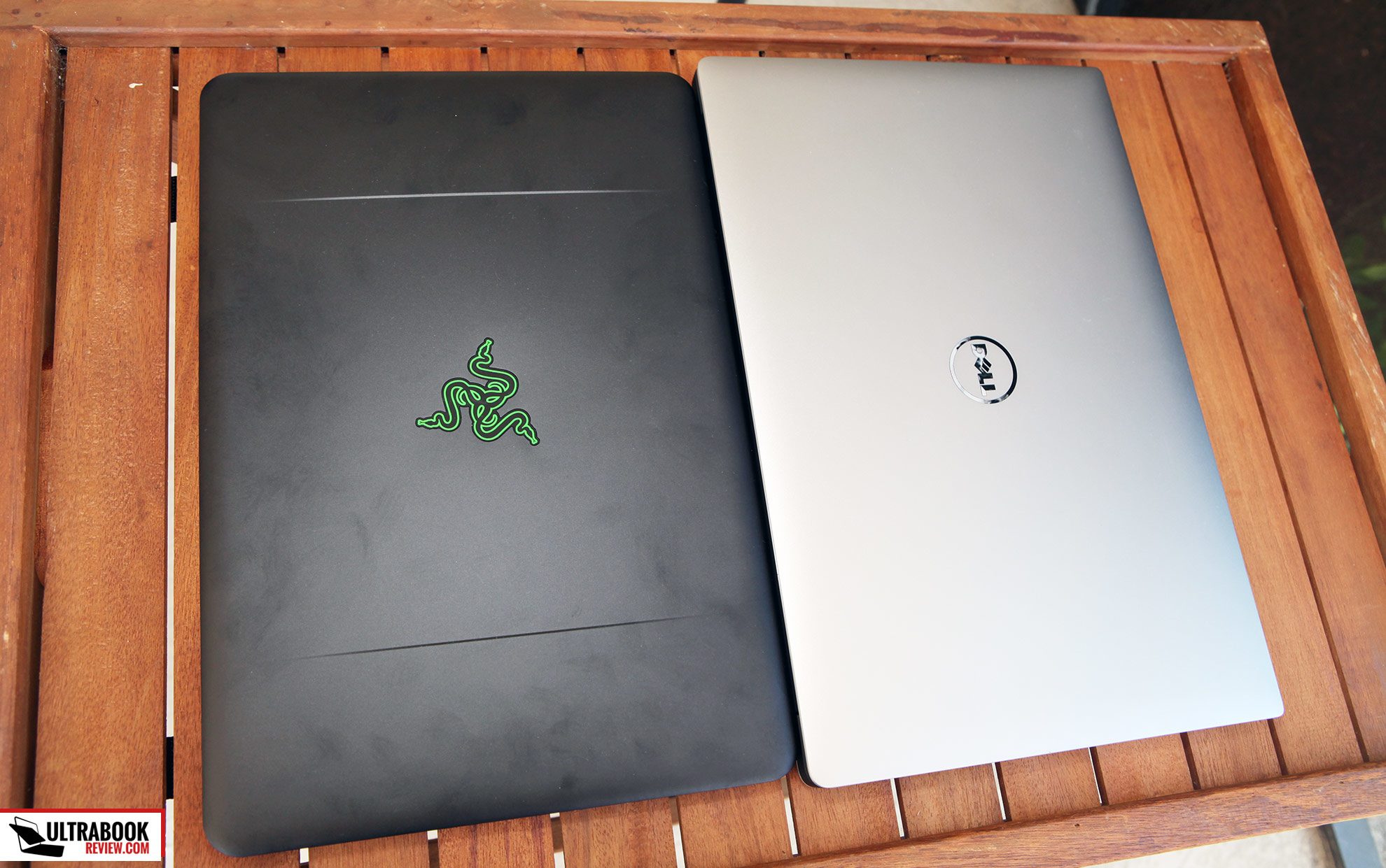 The dark Blade shows smudges easily, while the silver XPS looks much cleaner